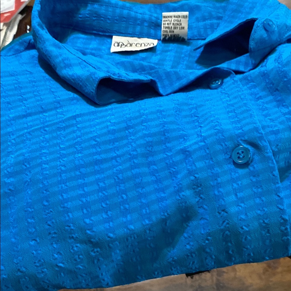 Blue 100per cent polyester blouse.